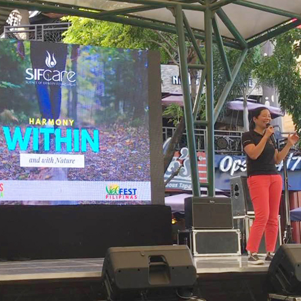 SIFCare volunteer on stage at VEGFEST Pilipinas