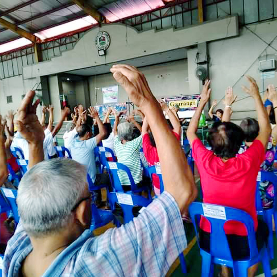 sifcare conducting breathing & seated exercises at the wellness mission in quezon