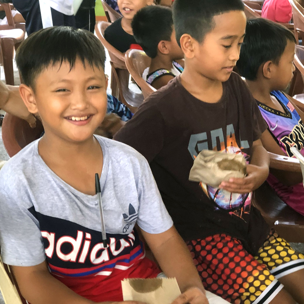 Happy kids with their meals at the SIFCare Gopalakas feeding program