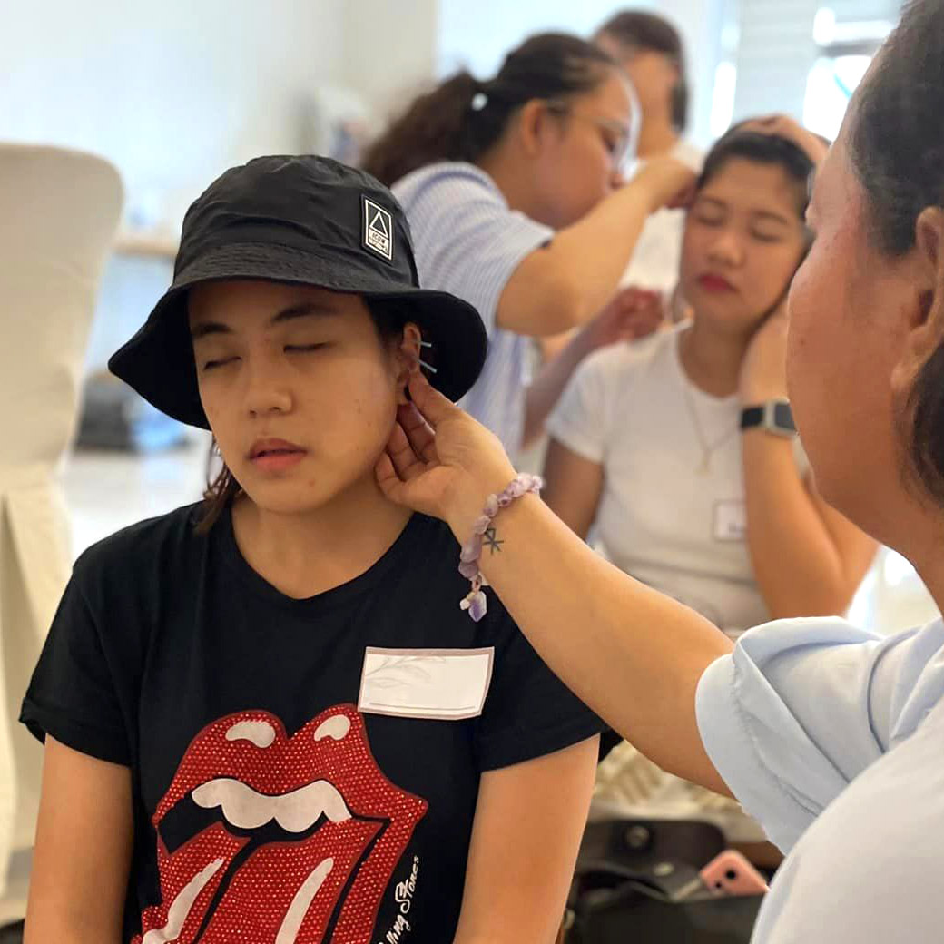 Ear acupuncture at the SIFCare Self-care wellness event